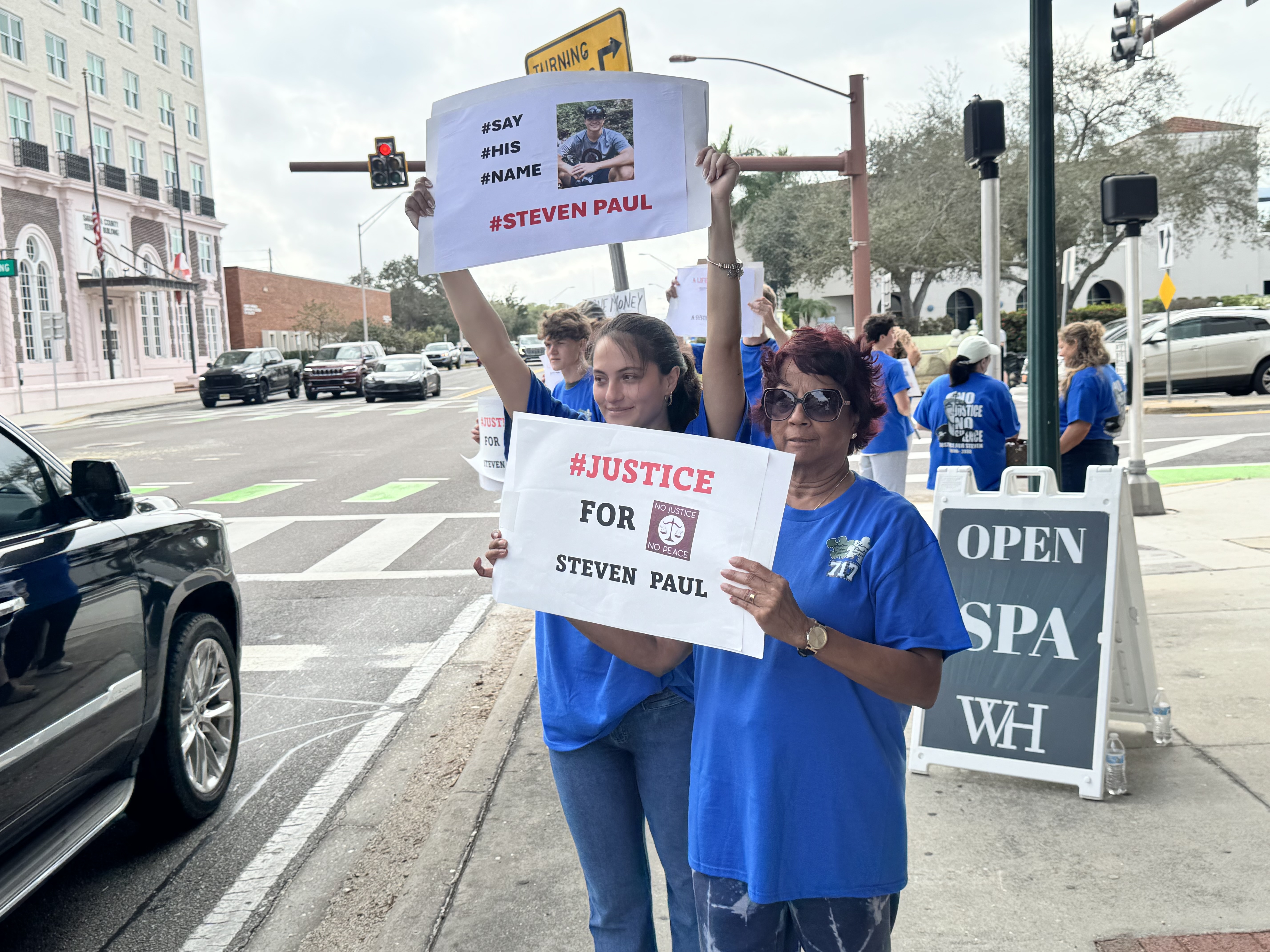 Protesters marching with Say His Name Steven Paul signs